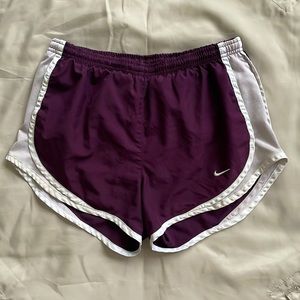 Plumb colored Nike shorts.